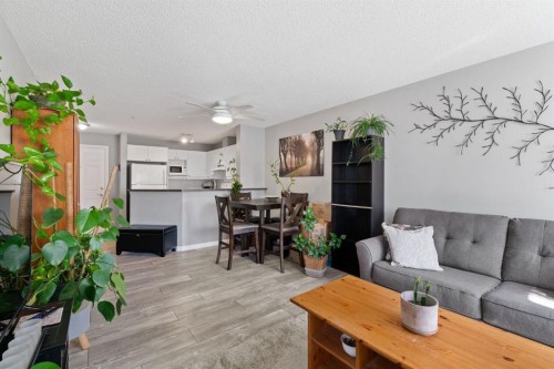 2209-950 Arbour Lake Road Nw, Calgary, AB - Indoor Photo Showing Living Room