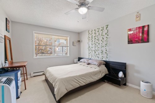 2209-950 Arbour Lake Road Nw, Calgary, AB - Indoor Photo Showing Bedroom