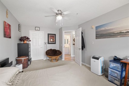 2209-950 Arbour Lake Road Nw, Calgary, AB - Indoor Photo Showing Bedroom