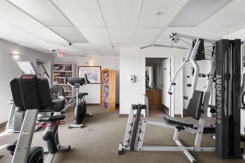 2209-950 Arbour Lake Road Nw, Calgary, AB - Indoor Photo Showing Gym Room