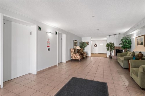 2209-950 Arbour Lake Road Nw, Calgary, AB - Indoor Photo Showing Living Room