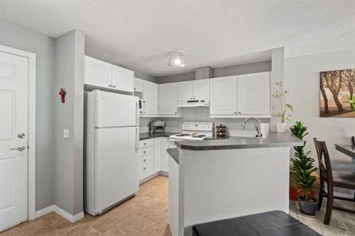 2209-950 Arbour Lake Road Nw, Calgary, AB - Indoor Photo Showing Kitchen