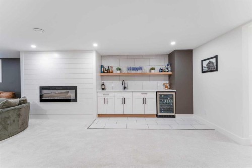 651 Willingdon Boulevard Se, Calgary, AB - Indoor Photo Showing Other Room With Fireplace