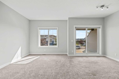304 Jumping Pound Common, Cochrane, AB - Indoor Photo Showing Other Room