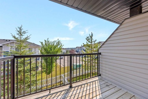 304 Jumping Pound Common, Cochrane, AB - Outdoor With Balcony With Exterior