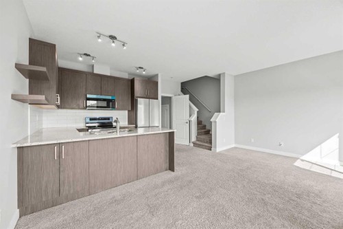 304 Jumping Pound Common, Cochrane, AB - Indoor Photo Showing Kitchen