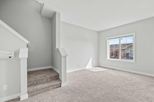 304 Jumping Pound Common, Cochrane, AB - Indoor Photo Showing Other Room