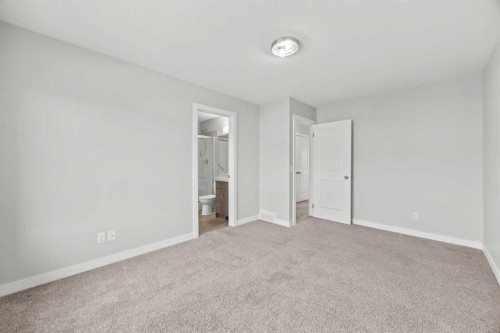 304 Jumping Pound Common, Cochrane, AB - Indoor Photo Showing Other Room