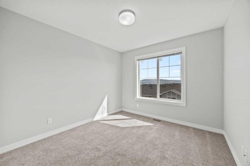 304 Jumping Pound Common, Cochrane, AB - Indoor Photo Showing Other Room