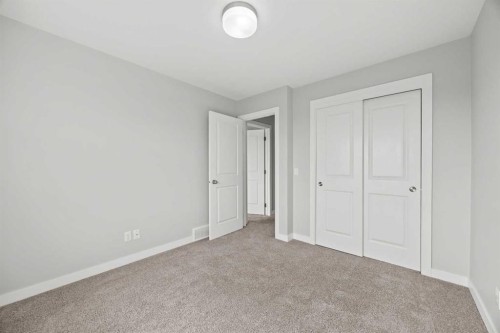 304 Jumping Pound Common, Cochrane, AB - Indoor Photo Showing Other Room
