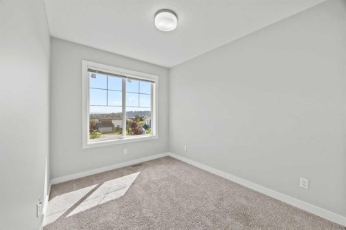304 Jumping Pound Common, Cochrane, AB - Indoor Photo Showing Other Room
