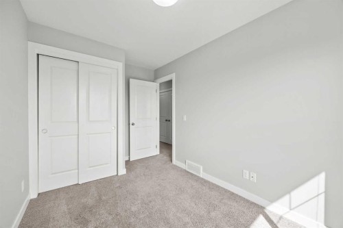 304 Jumping Pound Common, Cochrane, AB - Indoor Photo Showing Other Room