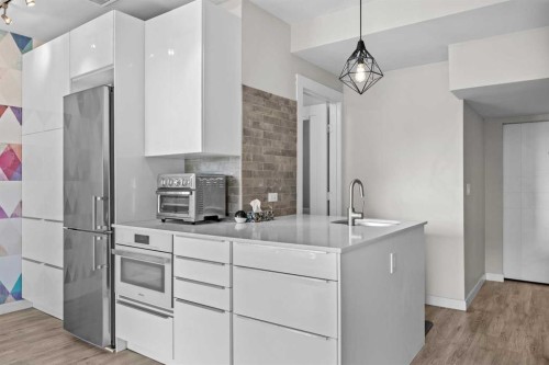 304 Jumping Pound Common, Cochrane, AB - Indoor Photo Showing Kitchen