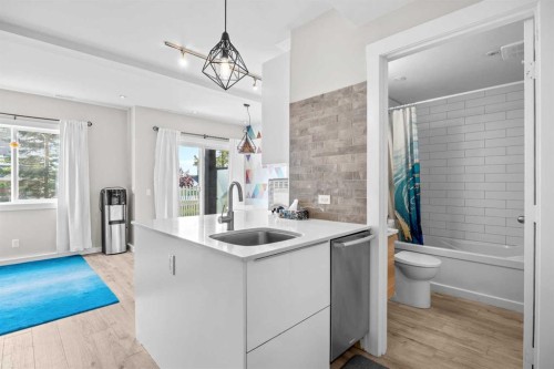 304 Jumping Pound Common, Cochrane, AB - Indoor Photo Showing Kitchen