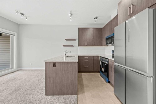 304 Jumping Pound Common, Cochrane, AB - Indoor Photo Showing Kitchen