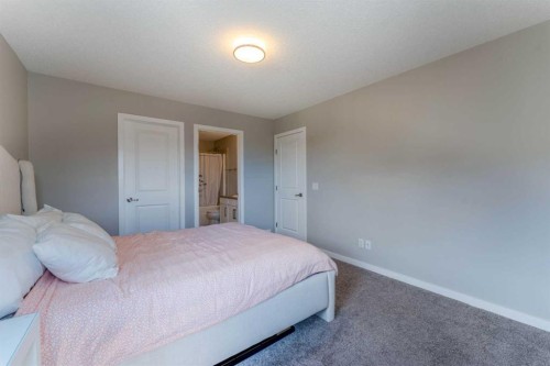 359 Sunrise View, Cochrane, AB - Indoor Photo Showing Bedroom