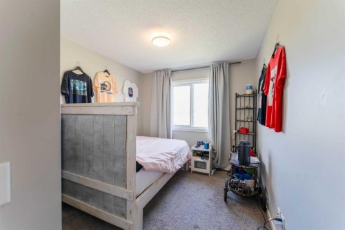 359 Sunrise View, Cochrane, AB - Indoor Photo Showing Bedroom