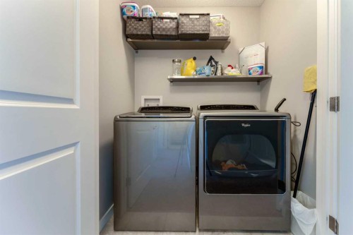 359 Sunrise View, Cochrane, AB - Indoor Photo Showing Laundry Room