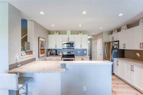 359 Sunrise View, Cochrane, AB - Indoor Photo Showing Kitchen With Stainless Steel Kitchen