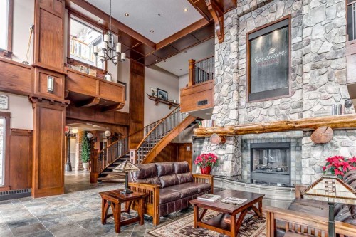 2146-2330 Fish Creek Boulevard Sw, Calgary, AB - Indoor Photo Showing Other Room With Fireplace
