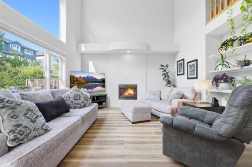 72 Arbour Crest Road Nw, Calgary, AB - Indoor Photo Showing Living Room With Fireplace