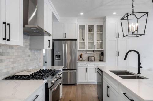 202 Kinniburgh Crescent, Chestermere, AB - Indoor Photo Showing Kitchen With Double Sink With Upgraded Kitchen