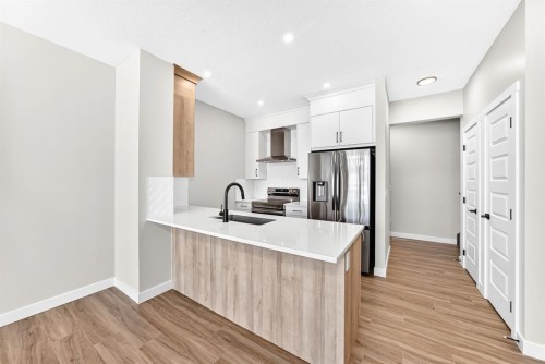 1069 Bayview Crescent Sw, Airdrie, AB - Indoor Photo Showing Kitchen With Upgraded Kitchen