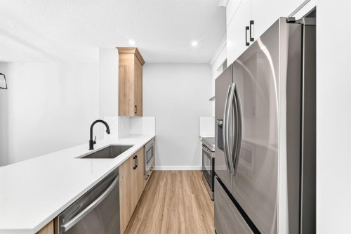 1069 Bayview Crescent Sw, Airdrie, AB - Indoor Photo Showing Kitchen With Upgraded Kitchen