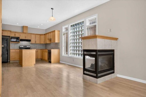 262 21 Avenue Ne, Calgary, AB - Indoor Photo Showing Kitchen With Fireplace