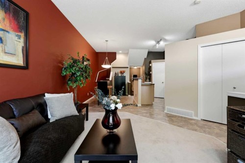 140 Promenade Way Se, Calgary, AB - Indoor Photo Showing Living Room