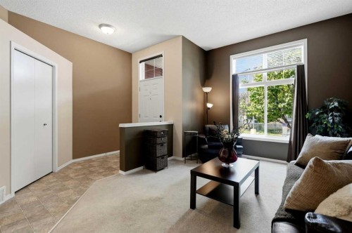 140 Promenade Way Se, Calgary, AB - Indoor Photo Showing Living Room