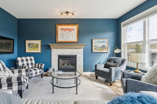 14 Riviera View, Cochrane, AB - Indoor Photo Showing Living Room With Fireplace