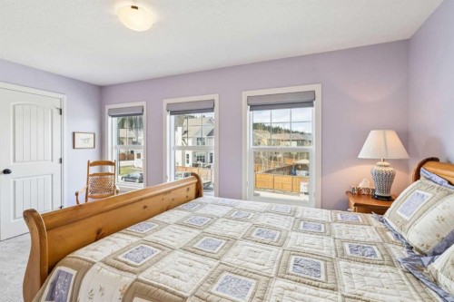 14 Riviera View, Cochrane, AB - Indoor Photo Showing Bedroom