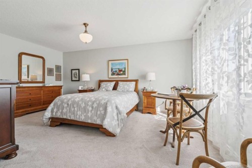 14 Riviera View, Cochrane, AB - Indoor Photo Showing Bedroom