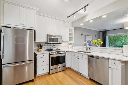 2027 4 Avenue Nw, Calgary, AB - Indoor Photo Showing Kitchen With Double Sink With Upgraded Kitchen