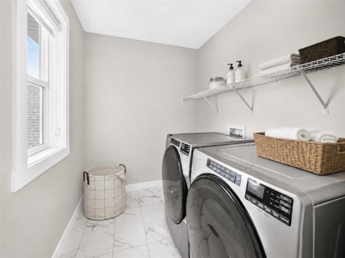 137 Creekside Way Sw, Calgary, AB - Indoor Photo Showing Laundry Room