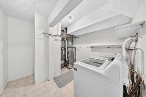 711-200 Brookpark Drive Sw, Calgary, AB - Indoor Photo Showing Laundry Room