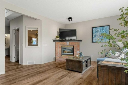 19 Citadel Ridge Close Nw, Calgary, AB - Indoor Photo Showing Living Room With Fireplace