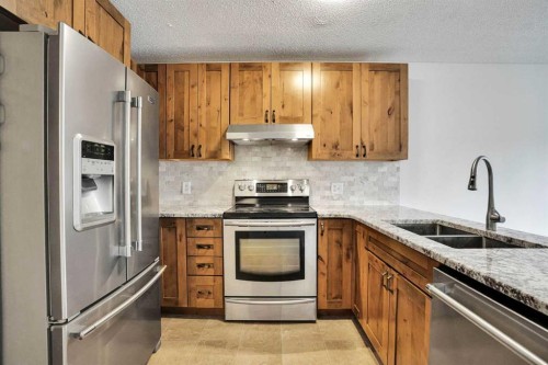 7152 Sierra Morena Boulevard Sw, Calgary, AB - Indoor Photo Showing Kitchen With Stainless Steel Kitchen With Double Sink