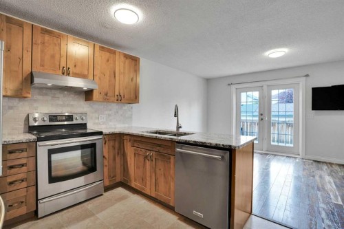 7152 Sierra Morena Boulevard Sw, Calgary, AB - Indoor Photo Showing Kitchen With Stainless Steel Kitchen With Double Sink