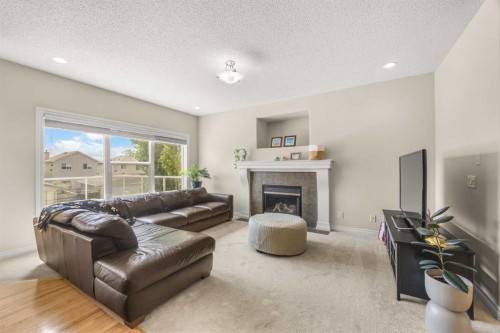 35 Covepark Place Ne, Calgary, AB - Indoor Photo Showing Living Room With Fireplace