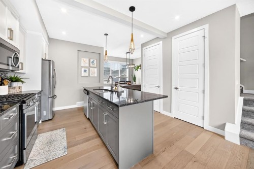 58 Precedence Link, Cochrane, AB - Indoor Photo Showing Kitchen With Upgraded Kitchen