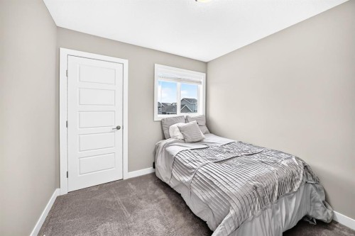 58 Precedence Link, Cochrane, AB - Indoor Photo Showing Bedroom
