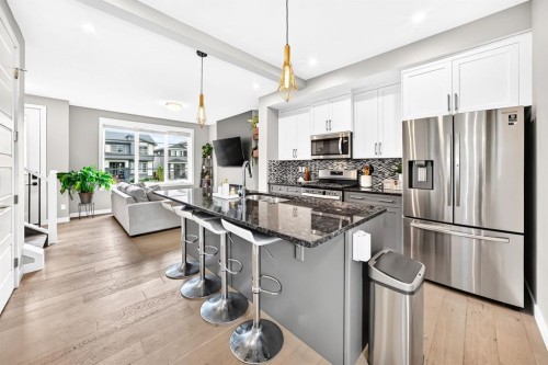 58 Precedence Link, Cochrane, AB - Indoor Photo Showing Kitchen With Upgraded Kitchen