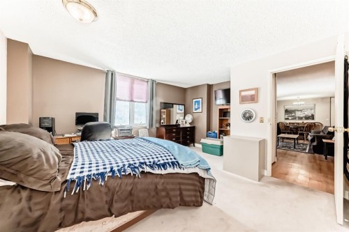 112-4944 Dalton Drive Nw, Calgary, AB - Indoor Photo Showing Bedroom