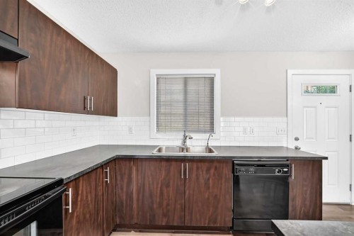 152 Pantego Lane Nw, Calgary, AB - Indoor Photo Showing Kitchen With Double Sink