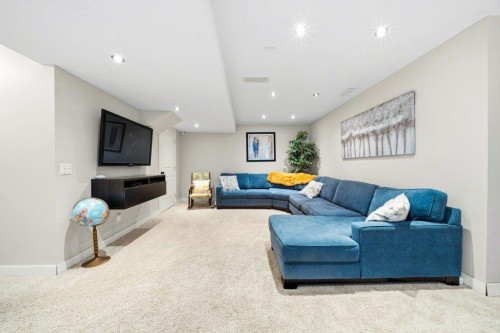 474 Tuscany Ravine Road Nw, Calgary, AB - Indoor Photo Showing Living Room With Fireplace