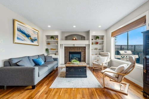 474 Tuscany Ravine Road Nw, Calgary, AB - Indoor Photo Showing Living Room With Fireplace