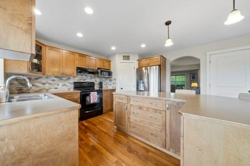 474 Tuscany Ravine Road Nw, Calgary, AB - Indoor Photo Showing Kitchen With Double Sink