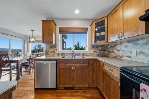474 Tuscany Ravine Road Nw, Calgary, AB - Indoor Photo Showing Kitchen With Double Sink